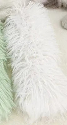 Blue, green, pink, and white plush cat toy pillow measuring 27 by 10 centimetres.