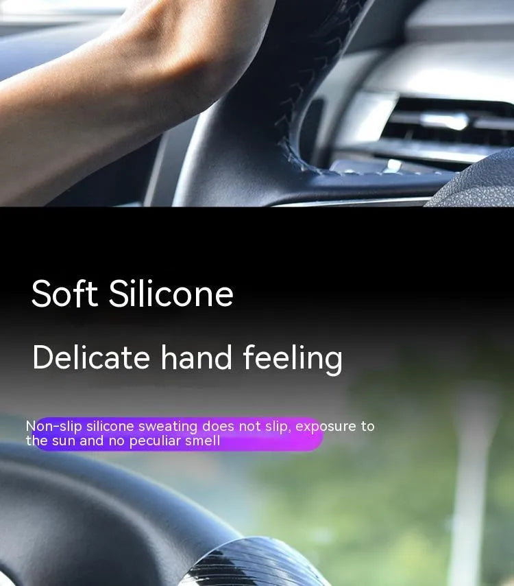 Black silicone steering wheel assist ball with metal bearing, shown next to a blue version.