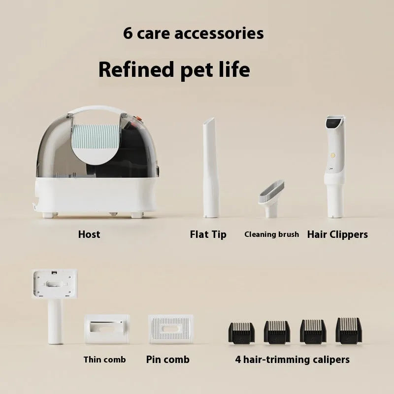 Pink and white pet grooming vacuum cleaner host with attachments including electric shear and combs.