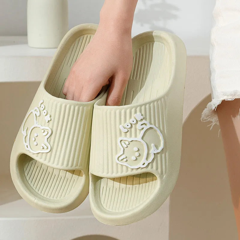 Green EVA foam cat slippers with thick platform sole and anti-slip pattern.