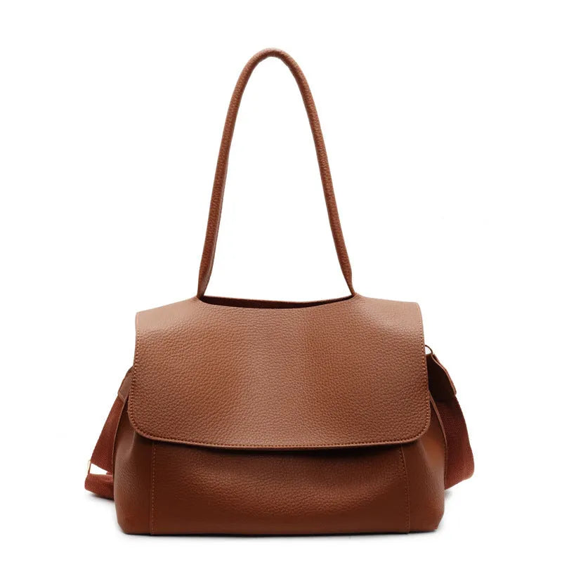 A brown PU tote bag with double shoulder straps and visible sewing thread detail.