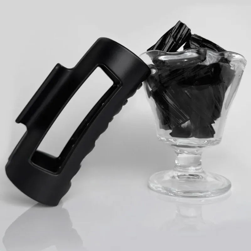 Extra large 13cm soft silicone shark clip in advanced black on a clean white background