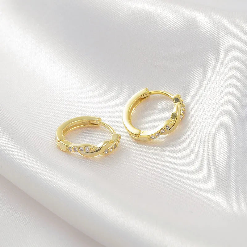 Geometric interwoven hemp rope earclip earrings in gold and silver colours with diamond-cut copper finish