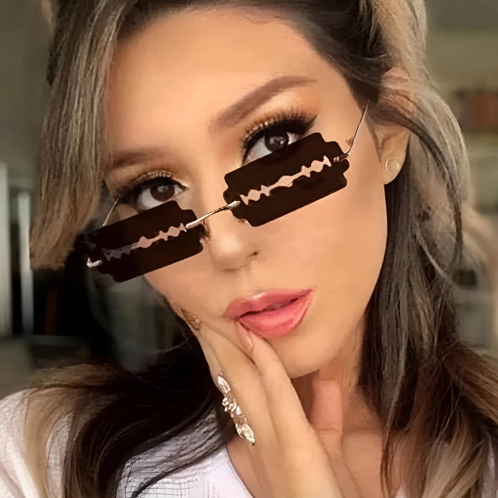 Gold metal rimless sunglasses with UV400 PC lens on a white background