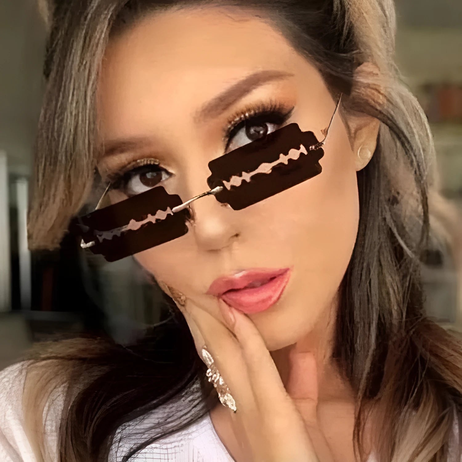 Gold metal rimless sunglasses with UV400 PC lens on a white background