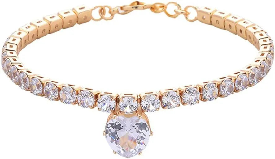 Gold rhinestone heart-shaped dog collar with bling design on a white background.