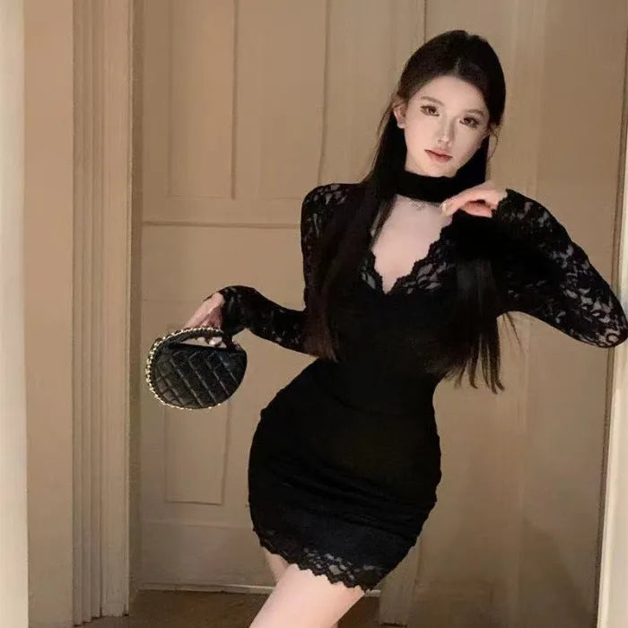 Women's black halter lace dress with floral patterning and A-line skirt silhouette