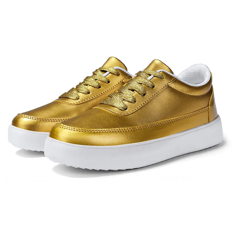 Women's gold leather lace-up flat casual shoes on a white background