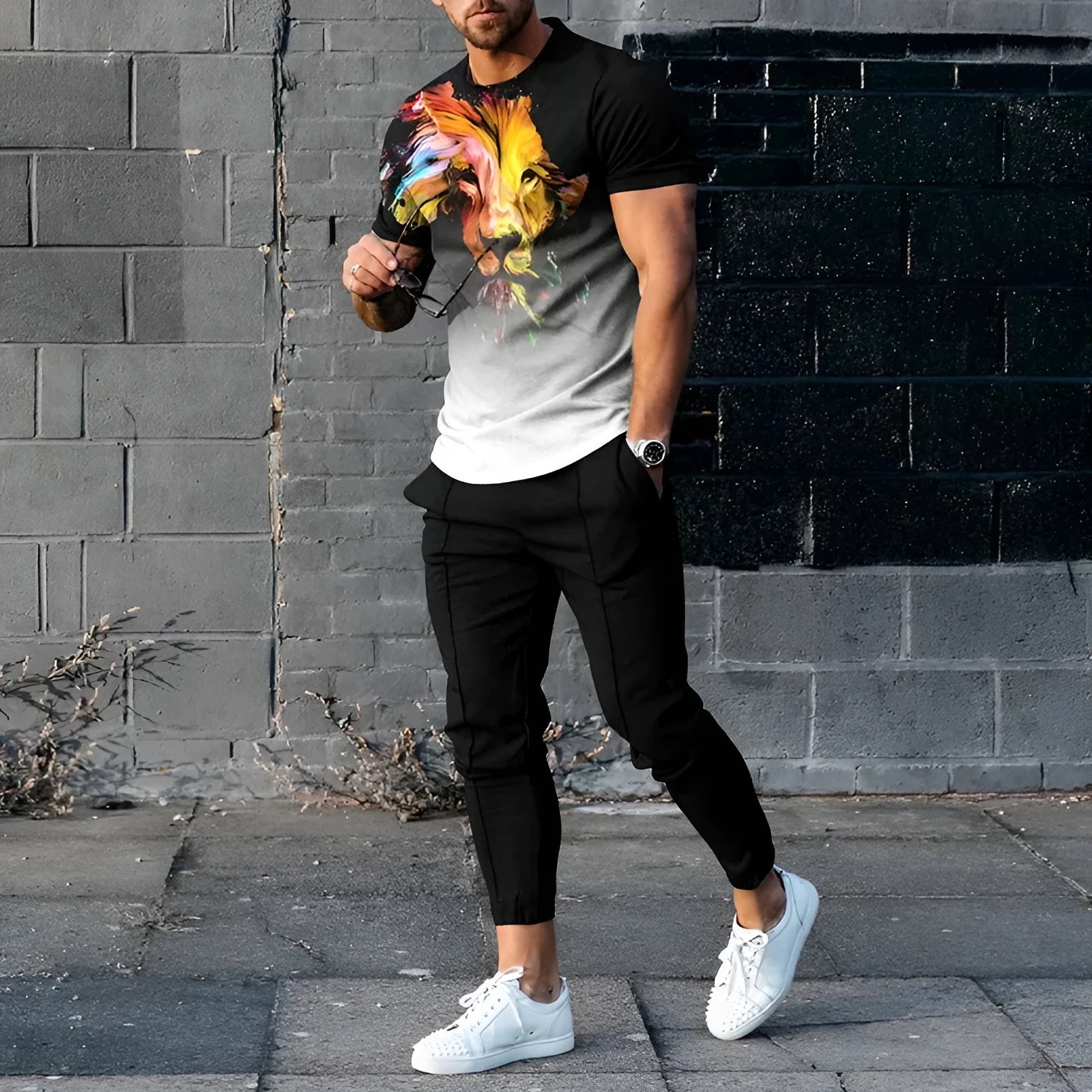 Man wearing a thin, short-sleeve polyester blend pullover and matching trousers from a sports tracksuit set.