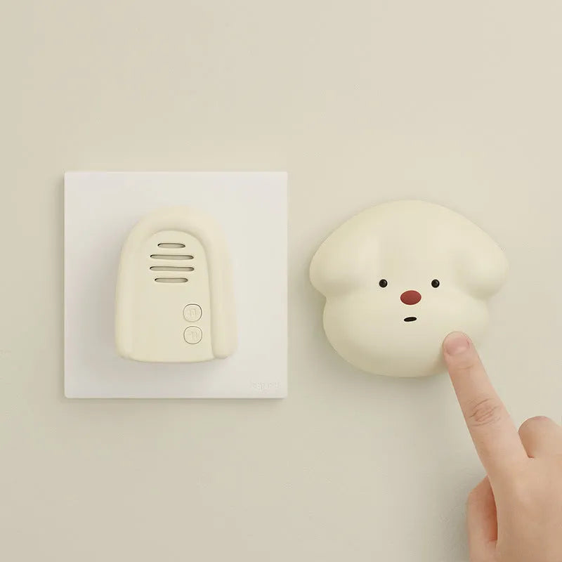 Wireless plug-in beeper doorbell in milky yellow or white colour for household use.