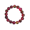 Handmade watermelon crystal bracelet for women on a wrist, showing pastoral design details.