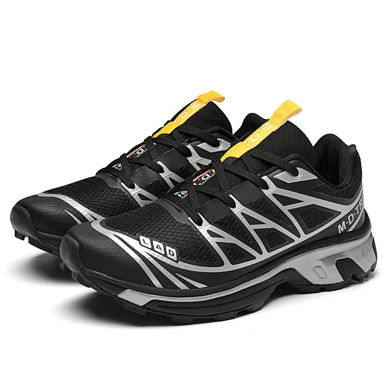Low-top hiking shoes in artificial leather with mesh lining and a flat rubber sole.