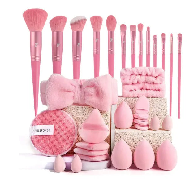 Beauty tool set with multiple pieces in brown, pink and purple colours for face wash and makeup application
