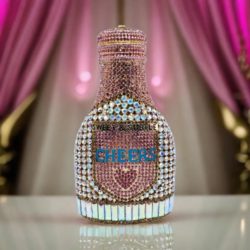 Gold rhinestone evening clutch bag shaped like a champagne bottle with a hard frame.
