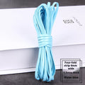 Coils of woven PU leather craft cord in various colours including black, brown, blue, red, and gold.