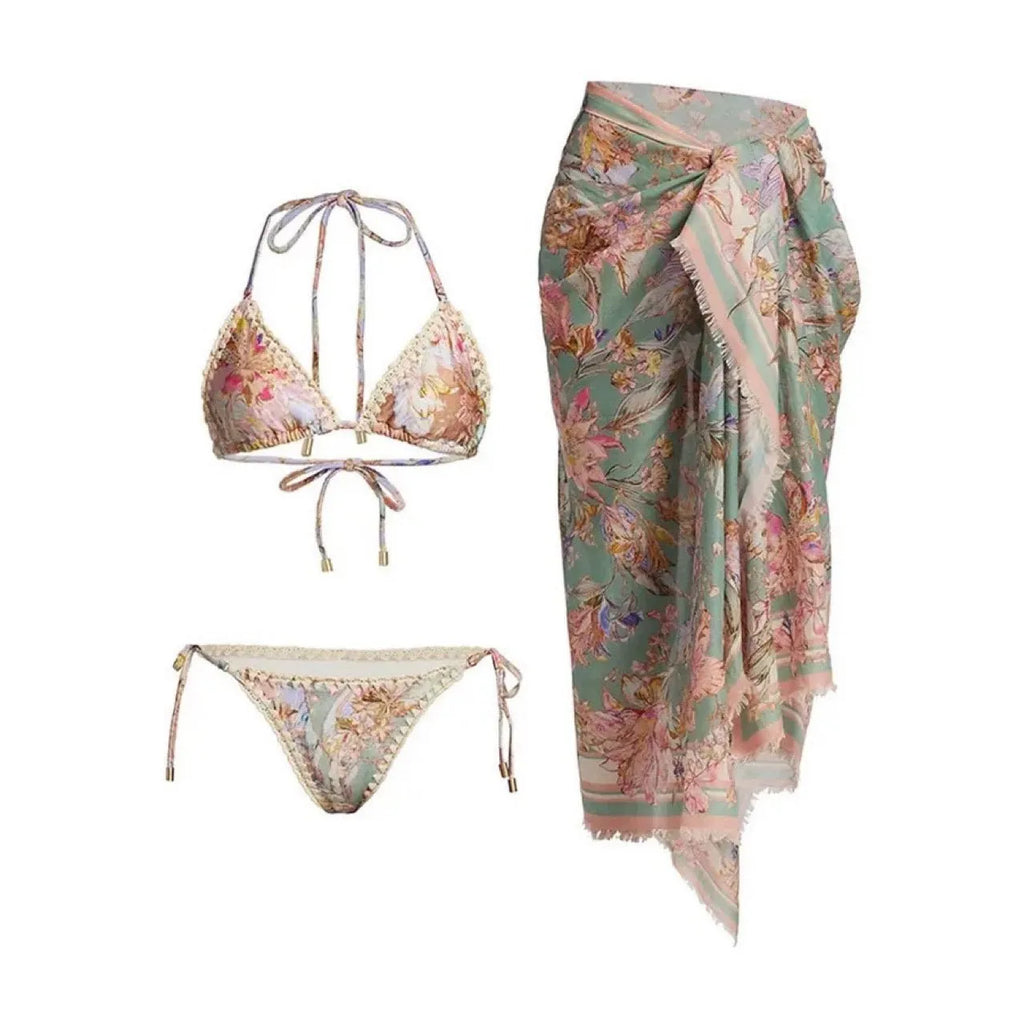 Creamy-white floral patterned women's three-piece bikini set with skirt.