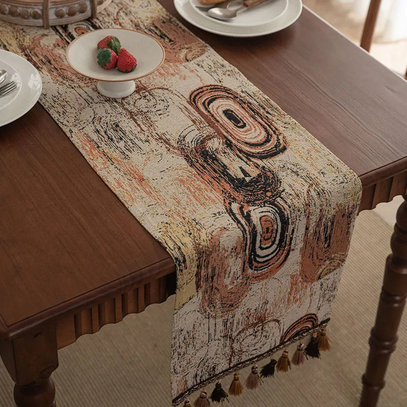 Rhyme Nordic Jacquard table runner with bouquet stripe pattern and tassel trim on dining table