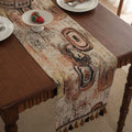 Rhyme Nordic Jacquard table runner with bouquet stripe pattern and tassel trim on dining table