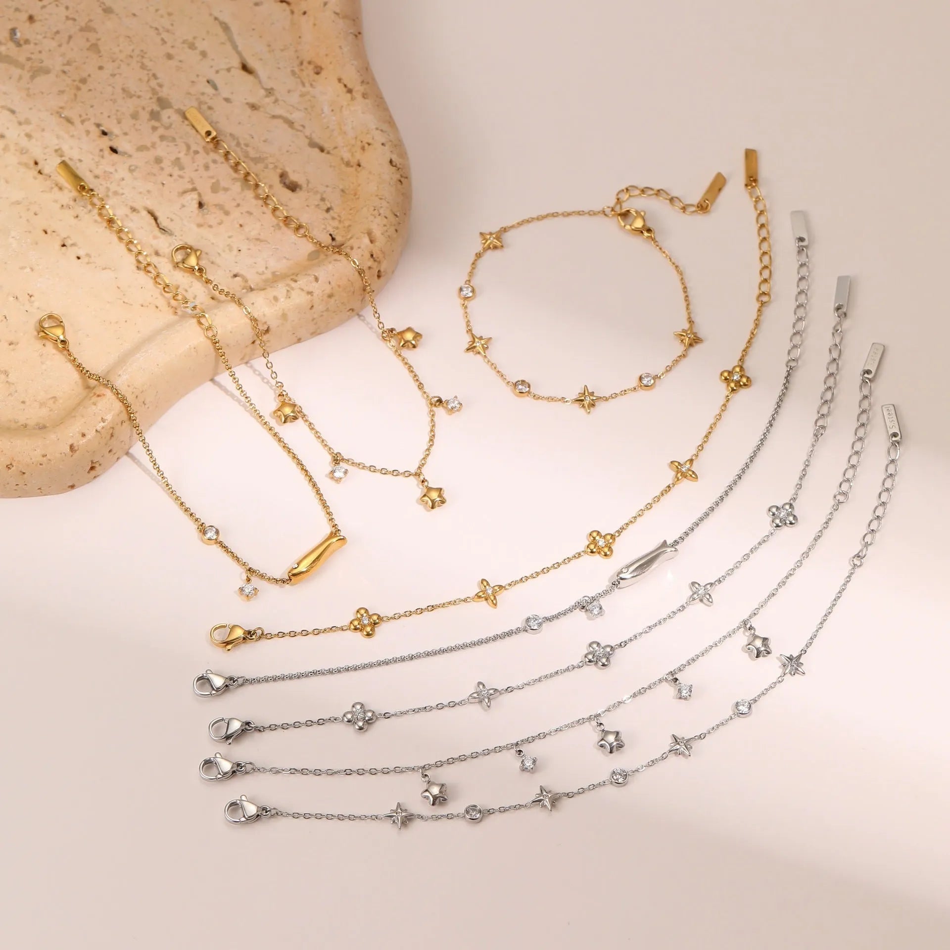 Women's titanium steel bracelet with geometric star pendant and 18K gold plating