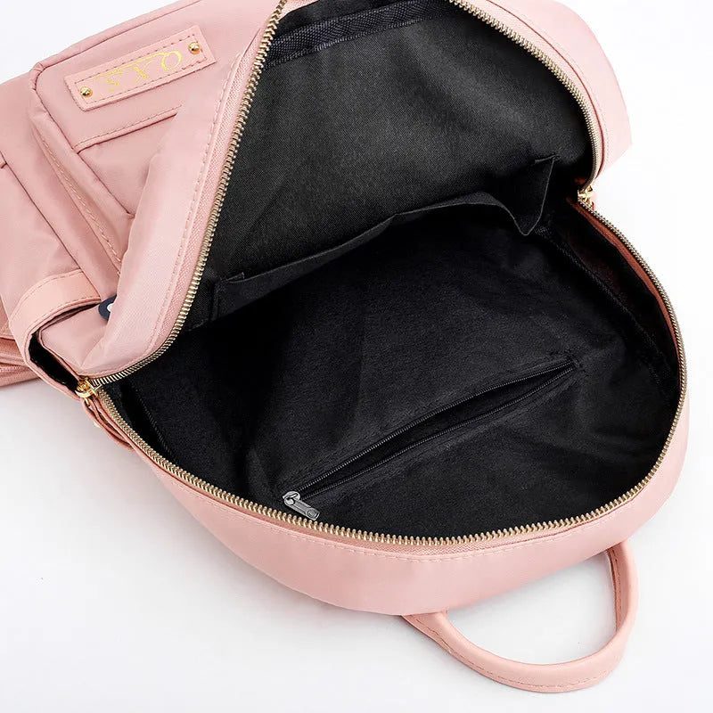 Women's black nylon casual backpack with double shoulder straps and external pockets
