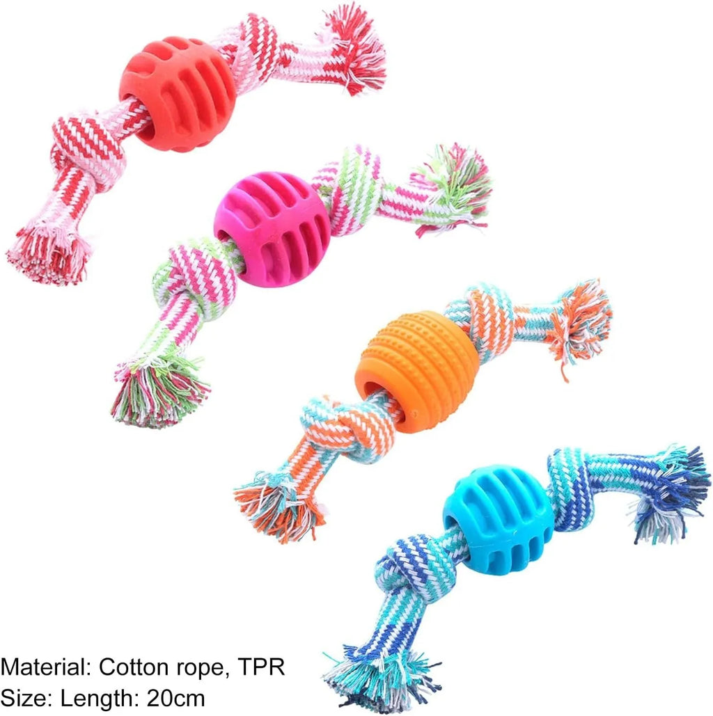 Blue silicone molar-ball dog chew toy with white rope ends on a wooden floor.