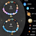 Two natural stone beaded zodiac bracelets with adjustable closures on a flat surface.