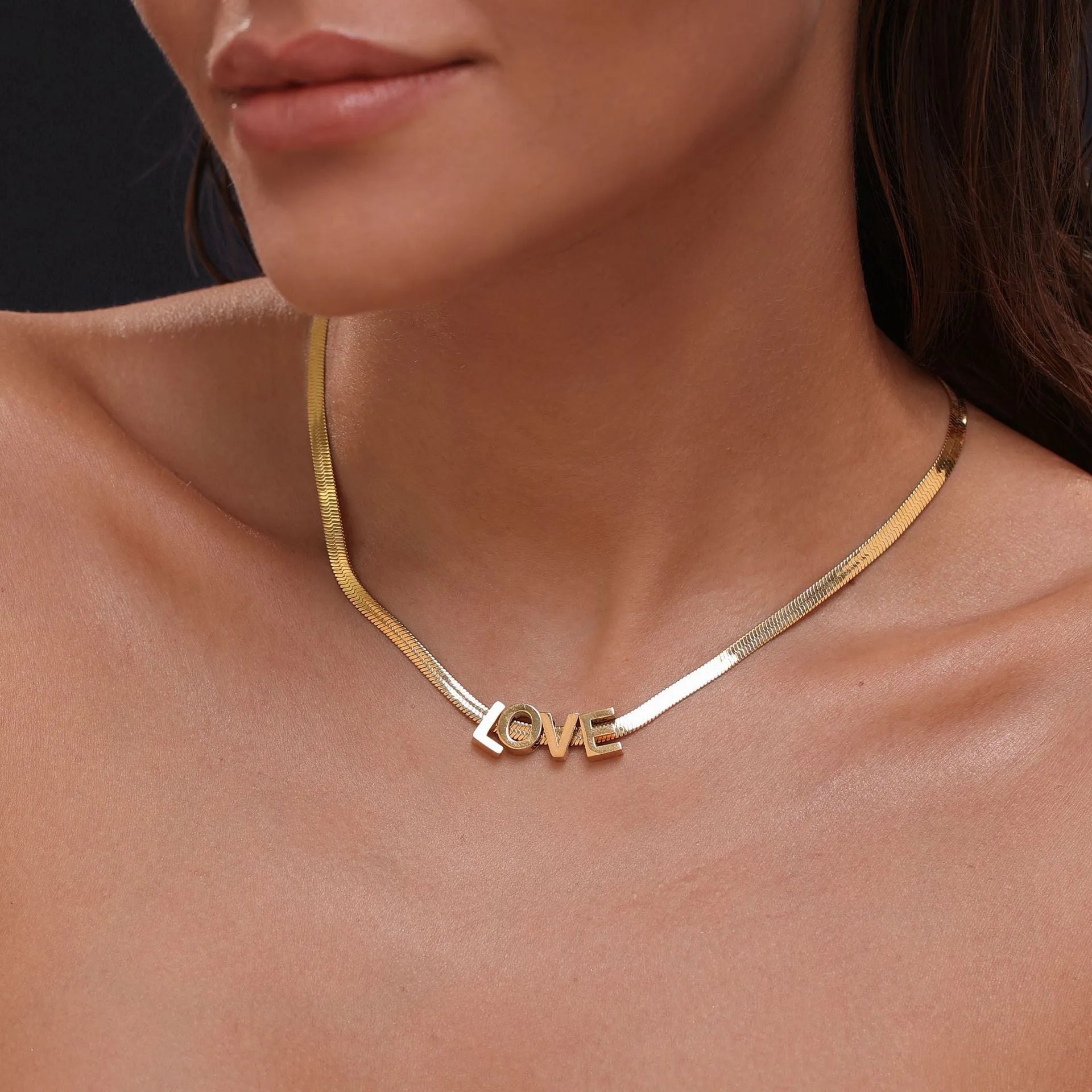 Gold electroplated titanium steel necklace with letter pendant on matching chain