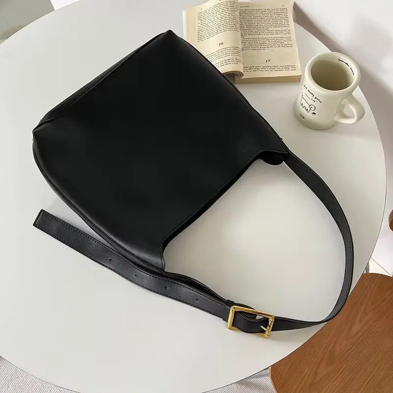Soft PU leather shoulder bag with swing threads decoration in black or brown colour