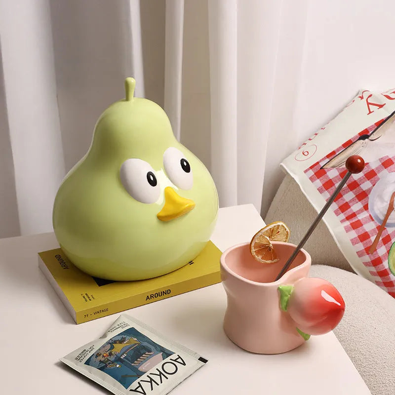 Ceramic pear-shaped tissue box holder in cute animal style with green glaze finish