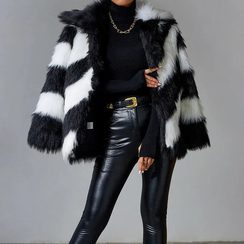 Women's lapel contrast colour faux fur coat with a detachable fur collar on a hanger