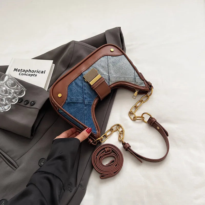 Brown denim women's shoulder bag with chain straps and bucket design showing phone compartment