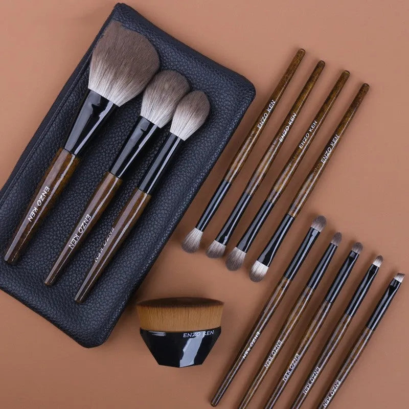 12-piece makeup brush set with wooden handles and a grey PU storage bag