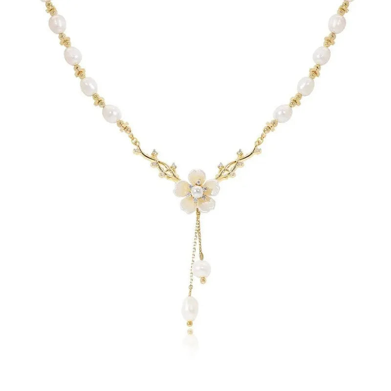 Pearl white alloy necklace with flower pearl charm and rose floral design elements on pearl chain