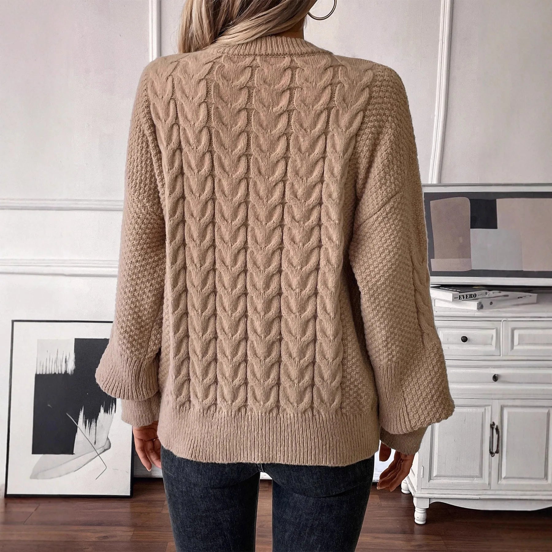 Women's beige loose pullover sweater with round neck and regular sleeves on hanger