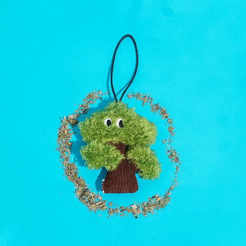 Pine tree shaped cat toy with cat mint element hanging for interactive play