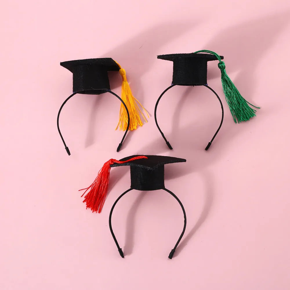 Pet wearing a British-style graduation cap hair band and matching bow tie