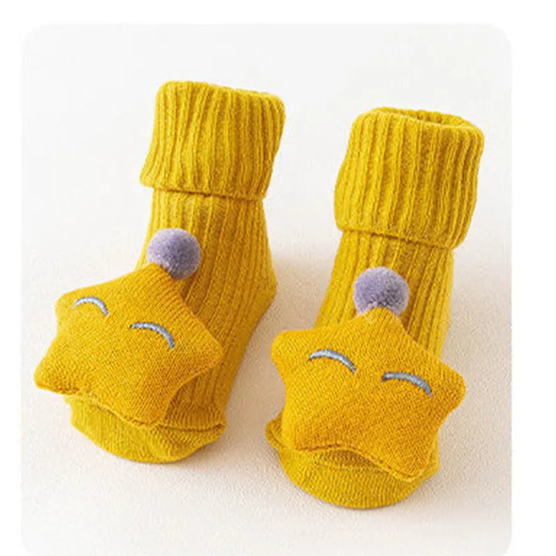 Cotton baby floor socks with non-slip soles in a pink bow print design.