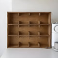 Square birch wood storage rack with multiple grid compartments for cup organisation in meridian colour finish