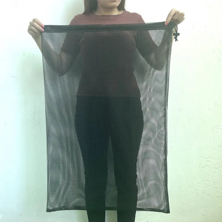 Black drawstring mesh storage bag showing grid fabric and three size options for toy organisation.