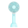 Blue handheld mini silent desktop USB electric fan with oscillating head on a desk