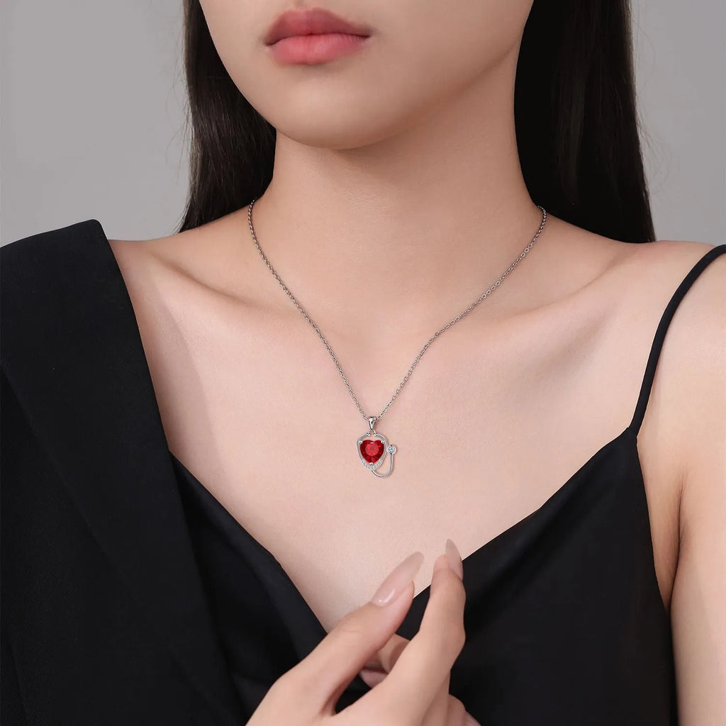 Women's copper necklace with a stethoscope pendant in a red diamond colour.