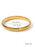 Women's titanium steel elastic bracelet with vertical stripe pattern and ring elements in gold finish