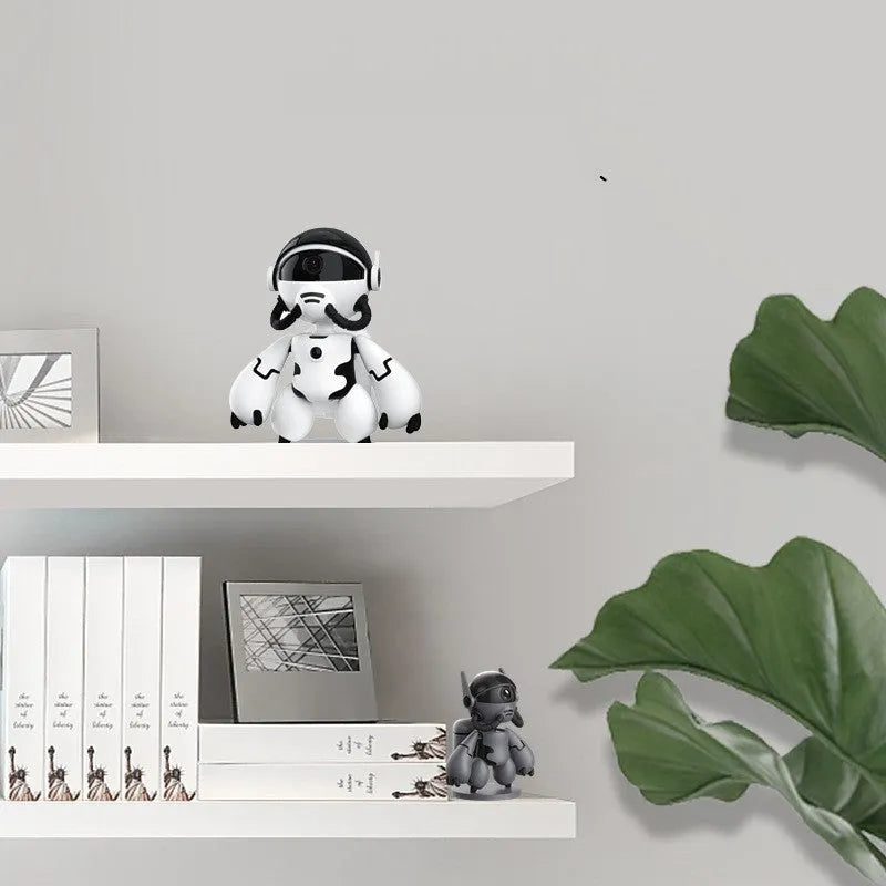 White or black Space Robot home monitoring camera with a wide-angle lens on a detachable base.