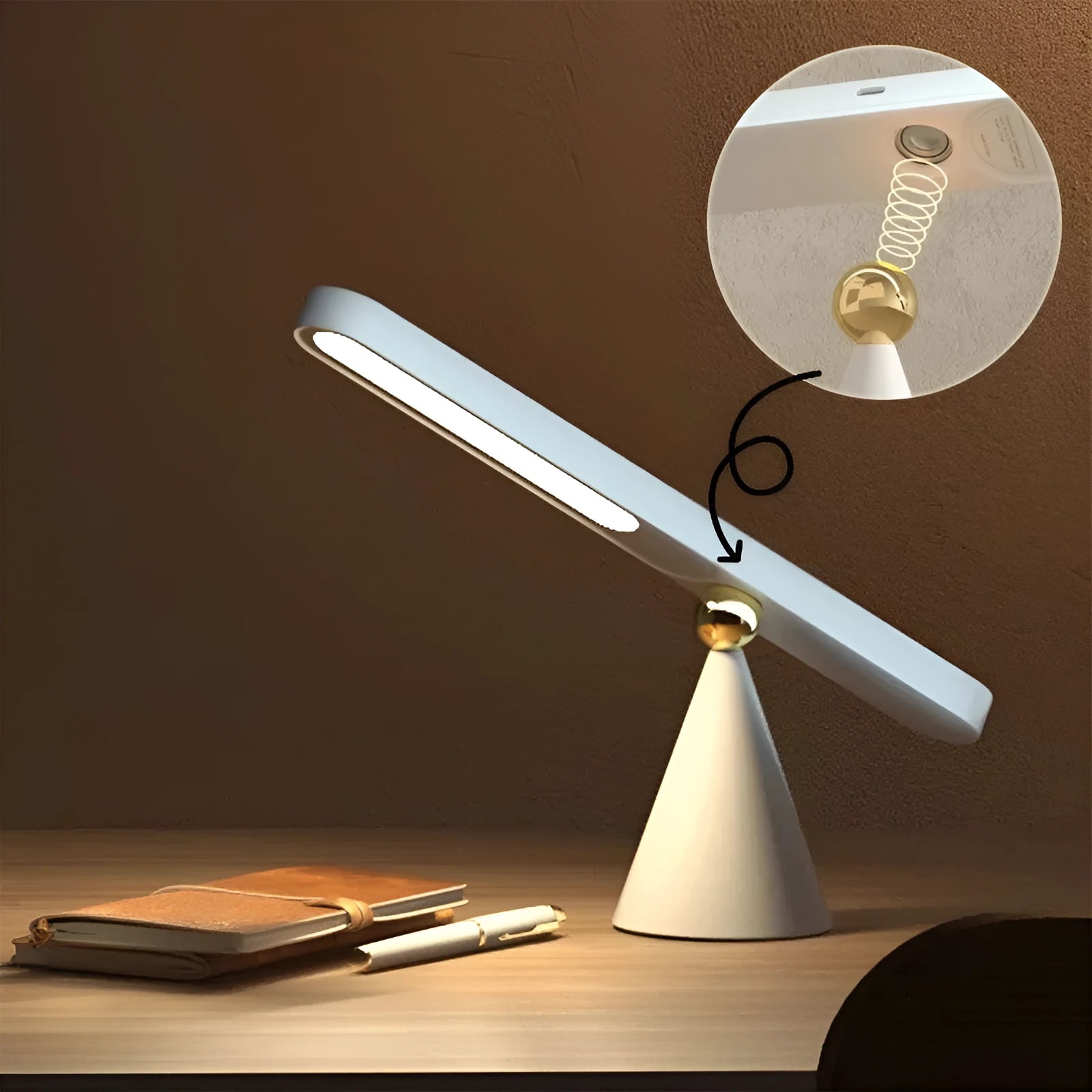White geometric desk lamp with touch control and magnetic base on a wooden table.