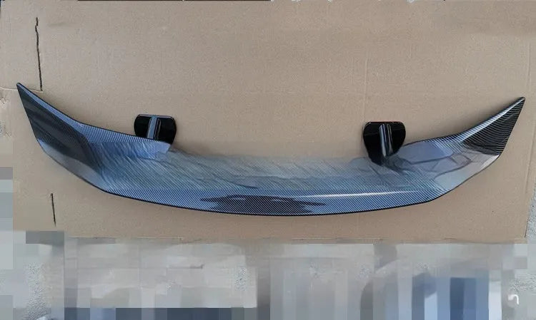 Universal punch-free car spoiler in ABS plastic showing blank, black, white, and carbon pattern finish options.