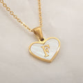 Gold-plated heart necklace with white shell pendant showing initial engraving on stainless steel chain