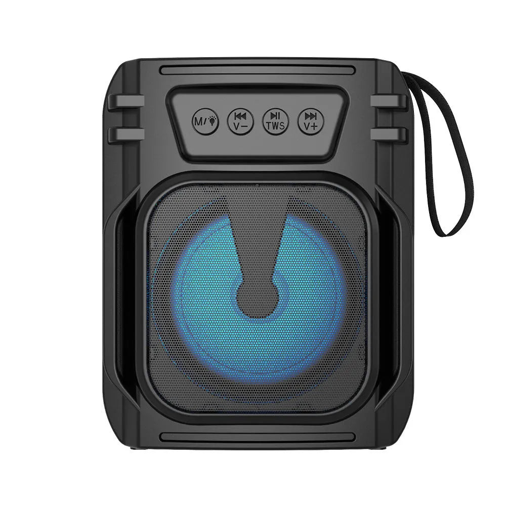 Compact portable Bluetooth speaker in neutral colour with USB charging cable.