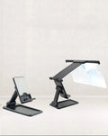 Black 12-inch mobile phone screen amplifier with detachable phone holder on desktop
