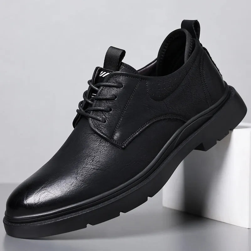 Men's black leather business sneakers with sewing line details on two-layer cowhide upper and rubber sole
