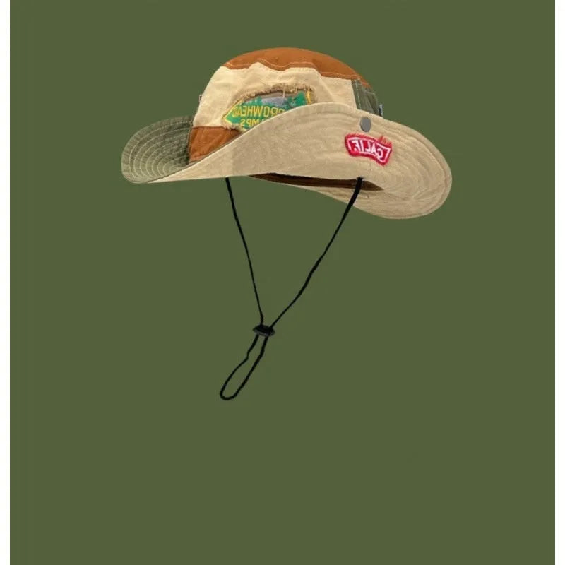 Army green cotton fisherman hat with flat crown and patchwork design folded for storage